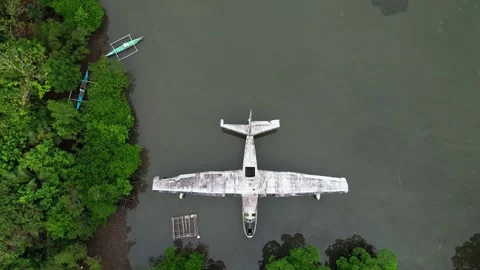 Drone footage of a wreck plane half submerged in Philippines Stockbeeldmateriaal 244472852
