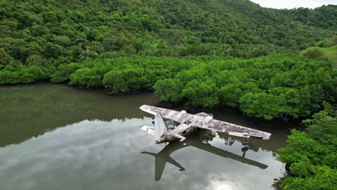 Drone footage of a wreck plane half submerged in Philippines Stockbeeldmateriaal 244473017