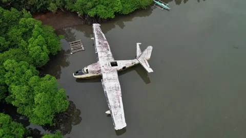 Drone footage of a wreck plane half submerged in Philippines Stock Footage 244473066