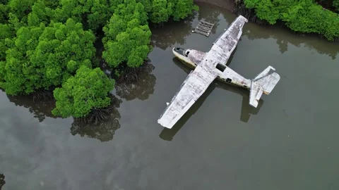 Drone footage of a wreck plane half submerged in Philippines Stock Footage 244473095