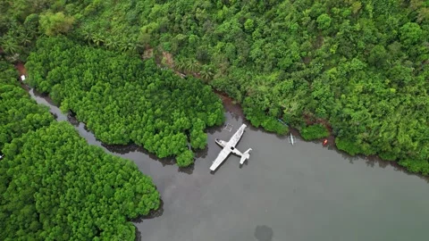 Drone footage of a wreck plane half submerged in Philippines Stock Footage 244473681