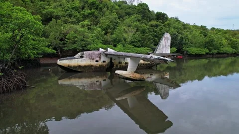 Drone footage of a wreck plane half submerged in Philippines 스톡 동영상 244473772