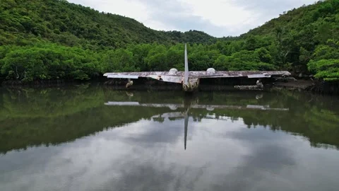 Drone footage of a wreck plane half submerged in Philippines Vídeos de archivo 244473796