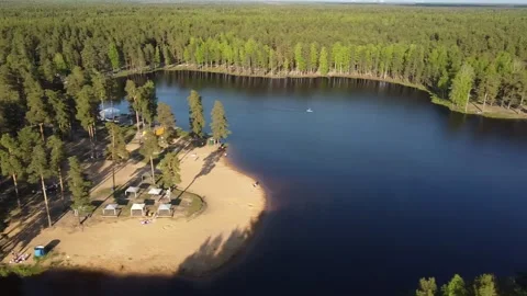Drone forest lake forest beach dark blue water Stock Footage 132921873