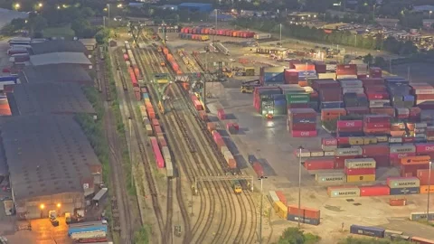 Drone forward flight above Trafford Park Intermodal Rail Terminal at blue hour Stock Footage 340344296