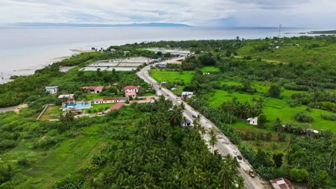Drone forward flight along highway and fish ponds Sibonga Cebu Philippines Vídeo Stock 331119449