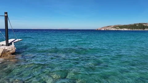 Drone Forward Flight Over Crystal Clear Turquoise Water on a Sunny Day Vídeo Stock 334062984