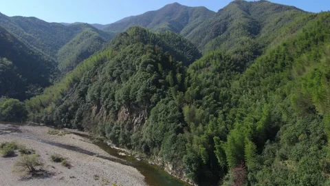 Drone Forward Flight Over Lush Mountain Valley and River Xuancheng China Stock Footage 330456870