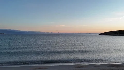 Drone Forward Flight Over Mediterranean Beach at Sunrise Near Shore Vídeo Stock 334671965