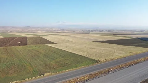 Drone forward flight over patchwork farmland fields Stock-Footage 331289917