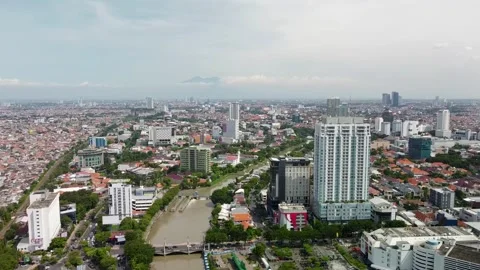 Drone Forward Flight Over Surabaya Cityscape with River, Indonesia Stock Footage 315235469