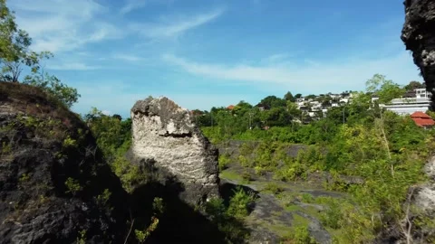 Drone forward flight over the trees between rocks Stock Footage 153044796