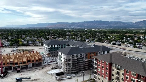 Drone forward flyover above apartment construction project in Taylorsville Utah Stock Footage 340423185