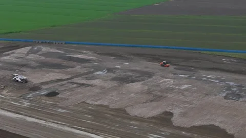 Drone forward flyover above earthworks for new industrial development Stock Footage 342246748