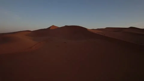 Drone forward flyover above Erg Chebbi dunes near Merzouga Morocco at sunset Stock Footage 337996033