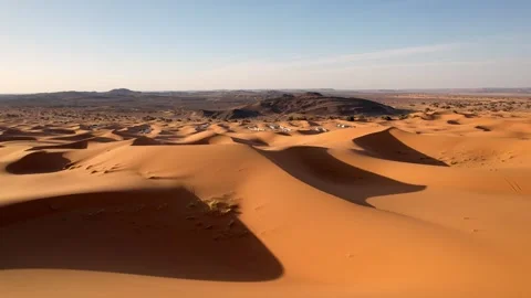 Drone forward flyover above guided 4x4 adventure across Erg Chebbi sand dunes Video stock 339250636
