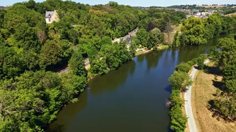 Drone forward flyover above Mayenne River, Parc des Ondines and Saint Peter 動画素材 340347549