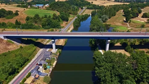 Drone forward flyover descending over LArmoricaine bridge and Mayenne River Stock Footage 340319391