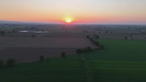 Drone forward flyover reveals spring farmland at sunrise across the Po Valley Stock Footage 340604245