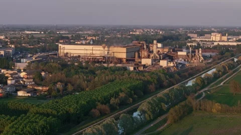 Drone forward flyover toward Acciaieria Arvedi steelworks and Canale Milano Stock Footage 340603954