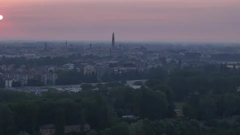 Drone forward flyover toward Cremona skyline with Torrazzo and historic bell Stock Footage 340603890