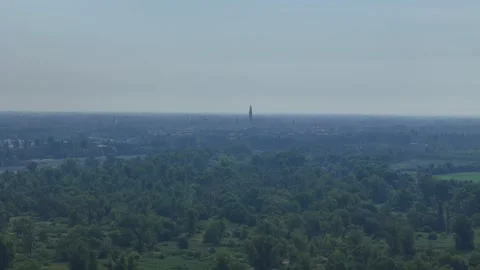 Drone forward flyover toward Cremona skyline with Torrazzo and historic bell Stock Footage 340603895