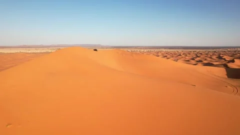 Drone forward follow tracking side-by-side UTV across Erg Chebbi dunes near Stock Footage 339755517