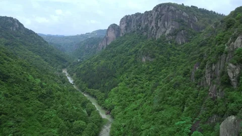 Drone Forward Over Green Mountain Valley and River Zhejiang China Stock Footage 330457649