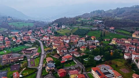 Drone Forward Over Hillside Village Near Lago d'Iseo With Red Rooftops and 스톡 동영상 336709264