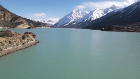 Drone Forward Push Over Ranwu Lake with Snow Mountains, Tibet, China Stock Footage 326207374