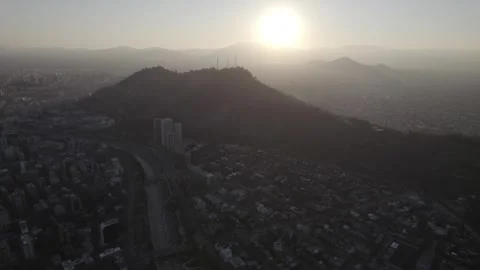 Drone Forward Shot Of Cerro San Cristobal Silhouettes At Sunset in Santiago Stock Footage 345606500