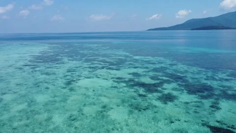 Drone Forward Shot Over Shallow Tropical Sea and White Sand Beach Stockbeeldmateriaal 332201243