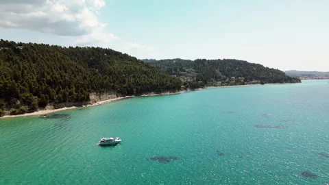 Drone Forward Shot Toward Pine Coast with Yacht, Kassandra, Halkidiki, Greece Stock Footage 329036668