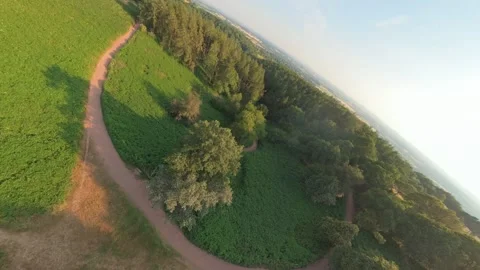 Drone FPV aerial view over a trail path through the English countryside Video stock 339624506