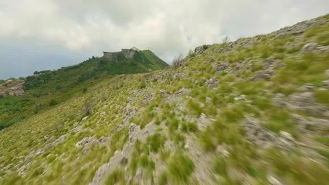 Drone FPV flight very fast over the crest of a mountain. Stock Footage 246748698