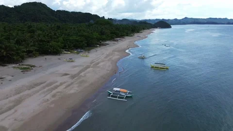 Drone fpv flying over the famous Sugar Beach with several outrigger boats along 스톡 동영상 345068679