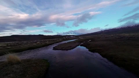 DRONE FPV OVER RIVER IN ARGENTINIAN PATAGONIA, AT SUNRISE Stock Footage 263927728