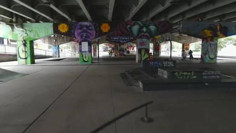Drone FPV view of Underpass park with people skating in Toronto Stock Footage 170952571