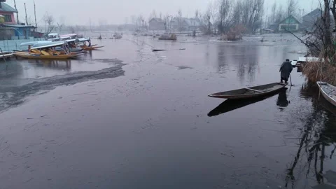 Drone frames the poetic stillness of Dal Lake’s interiors on a frozen morning. Stock Footage 311020526