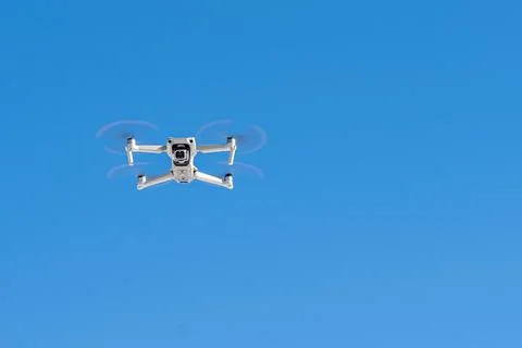 Drone front view in flight on clear sky Stock Photos