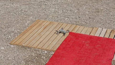 The Drone is Fully Prepared and Ready for Takeoff While Resting on a Stylish Stock Footage 311990753