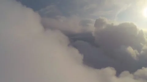 A drone gently floats above the clouds with a warm tint 库存影片 170071339