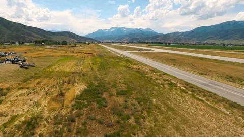 Drone is getting closer to biplane as it prepares for a take off Video stock 115603019