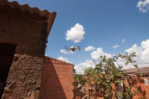 Drone getting ready to fly over a house Fotos de archivo