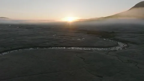 Drone of Glencoe, Scotland with low clouds at sunrise Stock Footage 254708975