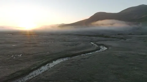 Drone of Glencoe, Scotland with low clouds at sunrise Stock Footage 254710245