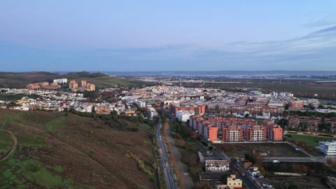 Drone glides over Camas as the sun rises over the Andalusian landscape, quiet Vídeo Stock 325784444