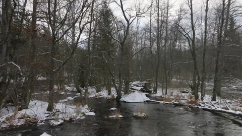 Drone glides over winter river Stock Footage 293693364