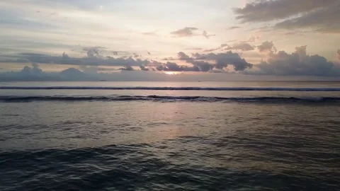 Drone Gliding Above Ocean Water at Sunset from Tropical Beach Stock Footage 337651021