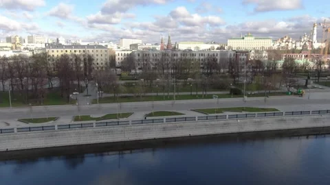 Drone gliding diagonally across quiet riverbank Stock Footage 323166310